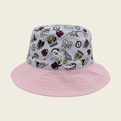 Bucket hat with pink brim and patterned top on a beige background