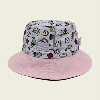 Pink bucket hat with a patterned brim on a beige background