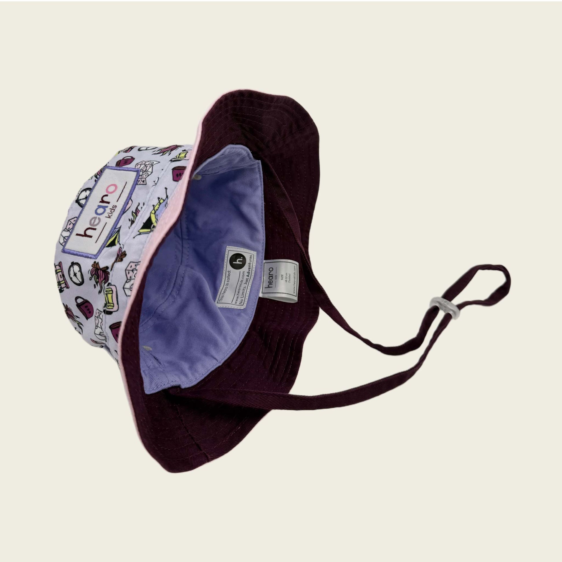 Bucket hat with colorful patterns on a beige background
