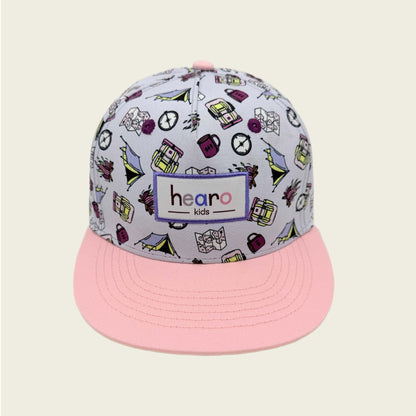 Cap with colorful patterns and pink brim on a beige background